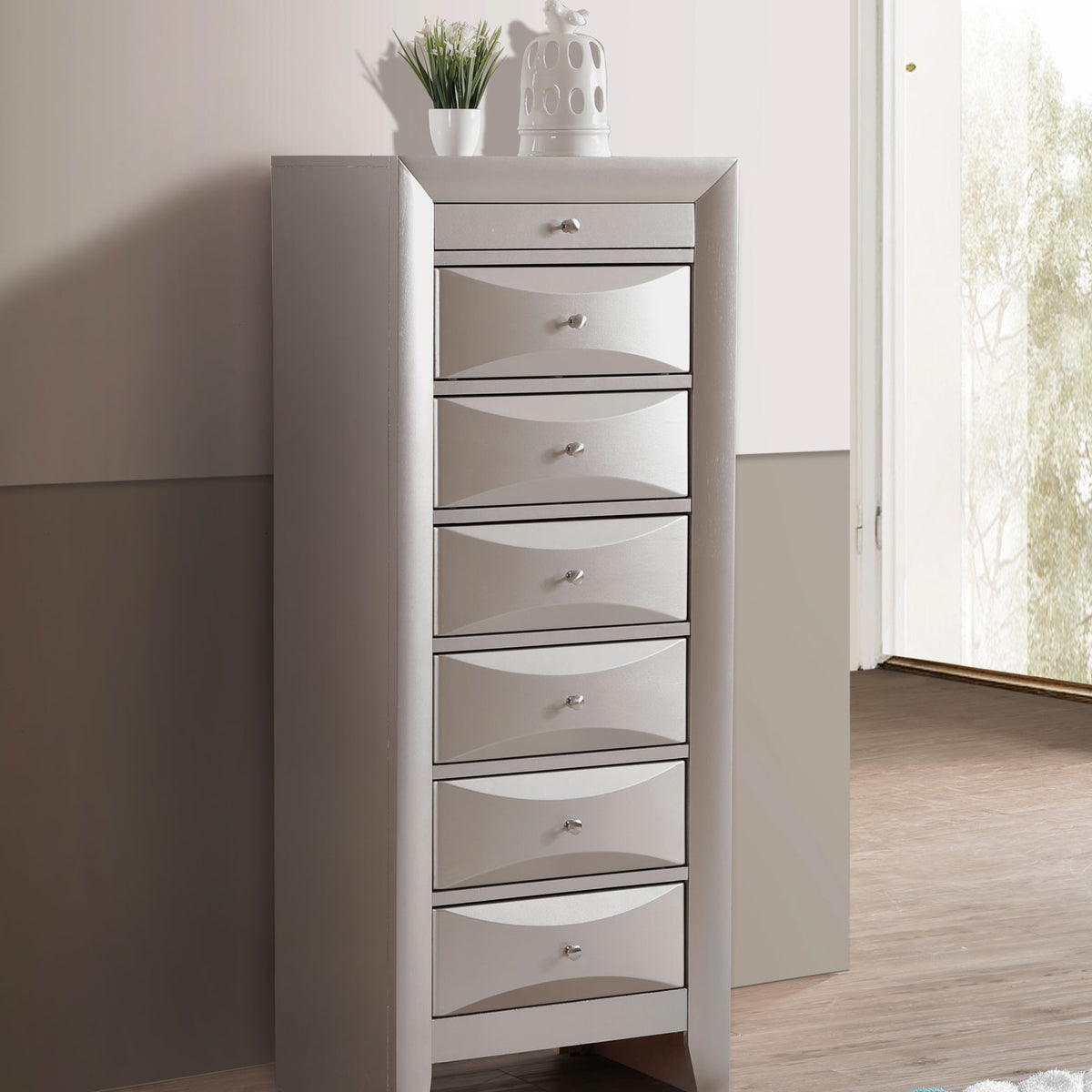 Light gray 7-drawer lingerie chest with metal pulls and stacked drawer fronts.