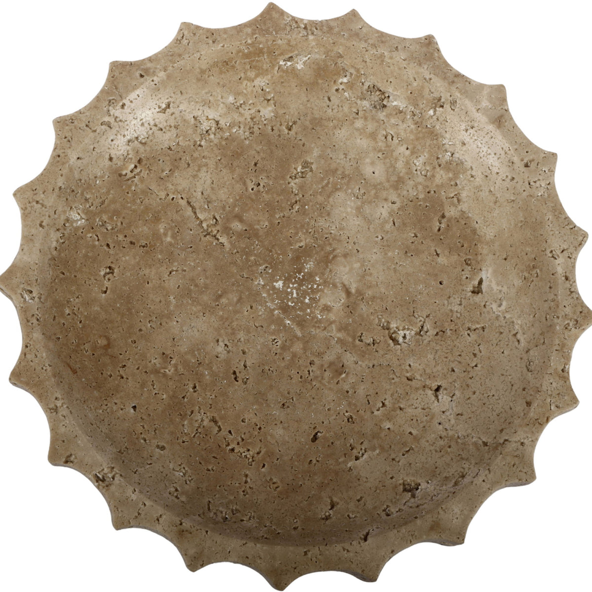 Beige travertine bowl with speckled surface and scalloped rim edge.