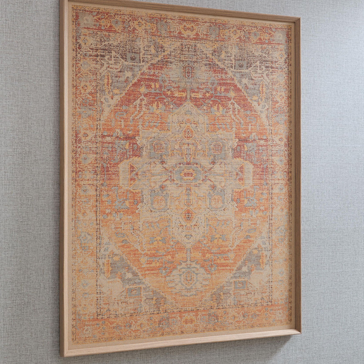 Framed wall art with intricate geometric pattern in red-orange tones with faded blue accents