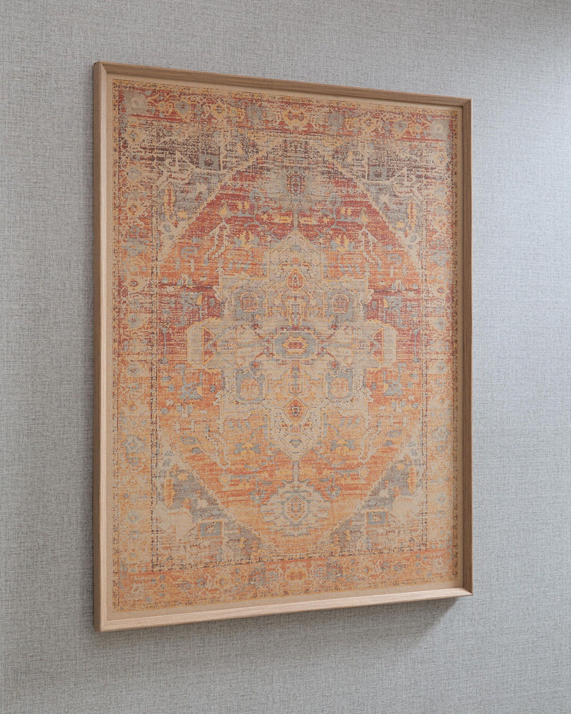 Framed wall art with intricate geometric pattern in red-orange tones with faded blue accents