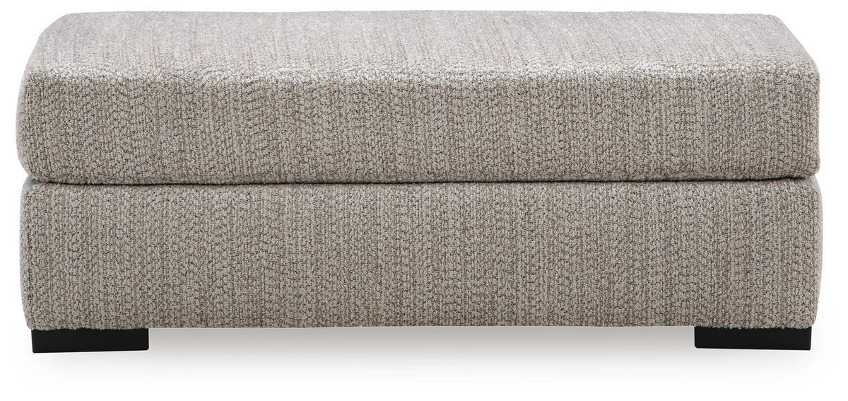 Gray rectangular ottoman with cushioned lid and black block feet