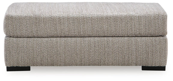 Gray rectangular ottoman with cushioned lid and black block feet