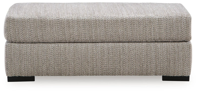 Gray rectangular ottoman with cushioned lid and black block feet