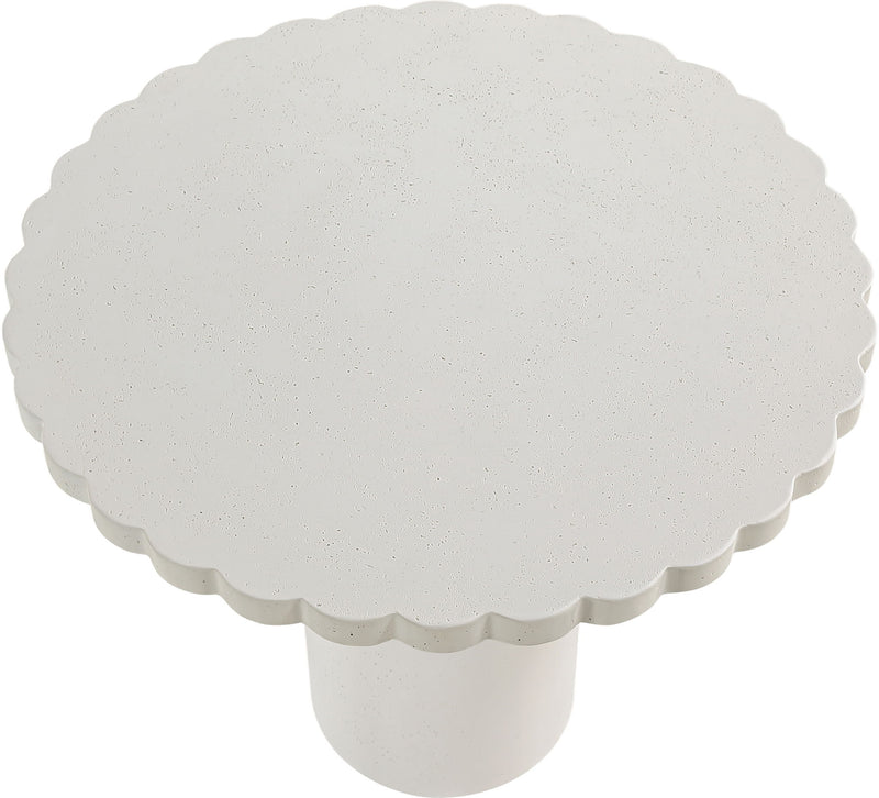 Indoor/outdoor table with round scalloped top and white pedestal base