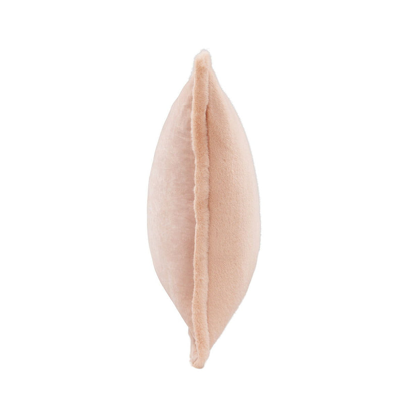 Peach plush pillow with visible side seam and stuffed look