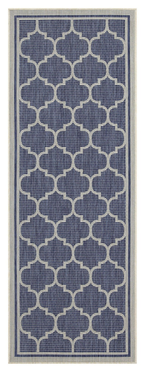 Blue polypropylene area rug with repeating quatrefoil pattern and thin border