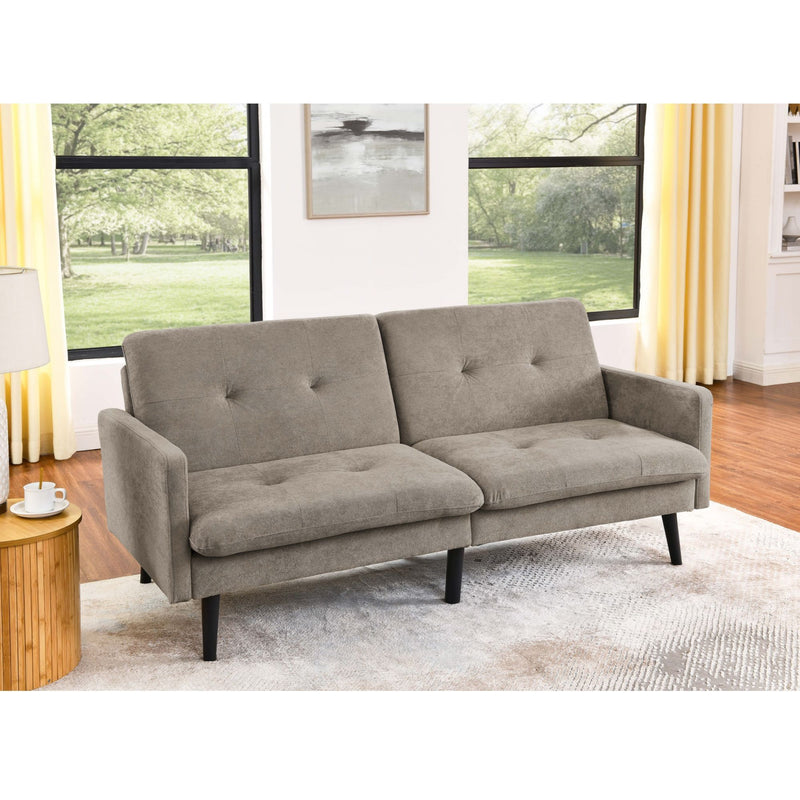 Light brown futon sofa with tufted back and seat cushions, shown in a living room