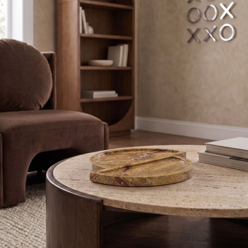 Light brown marble tray on a coffee table with two round split halves