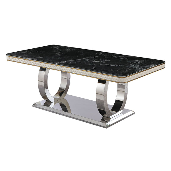 Black marble-look dining table with gold-edged top and polished metal pedestal base