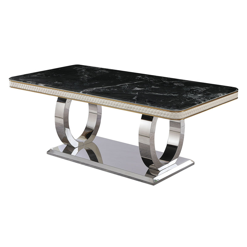 Black marble-look dining table with gold-edged top and polished metal pedestal base