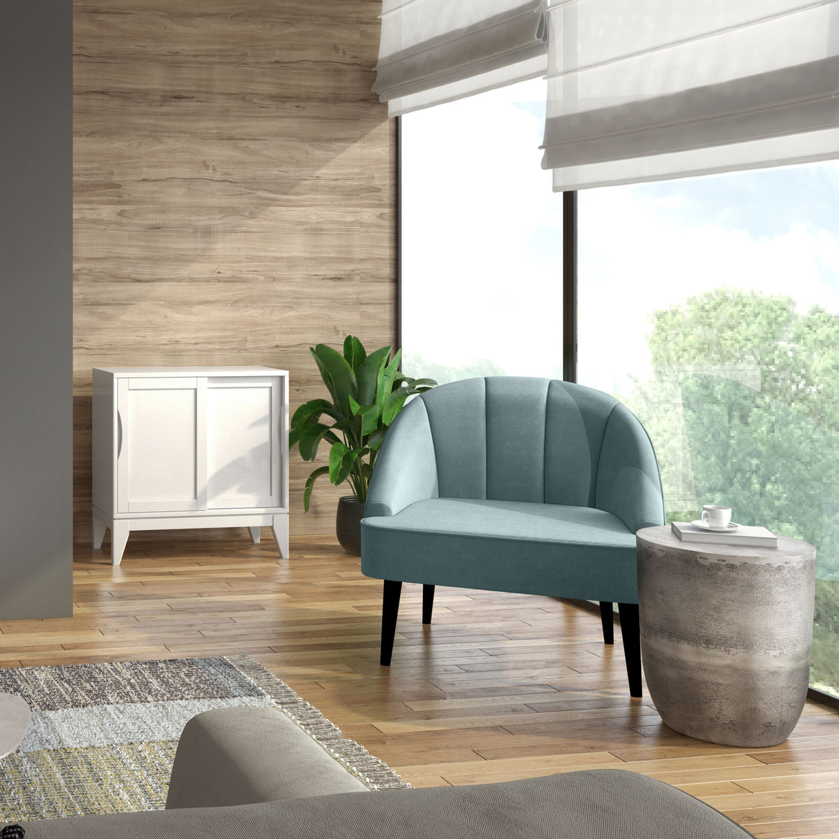 Round accent table with pearl silver metal drum body, styled beside sofa