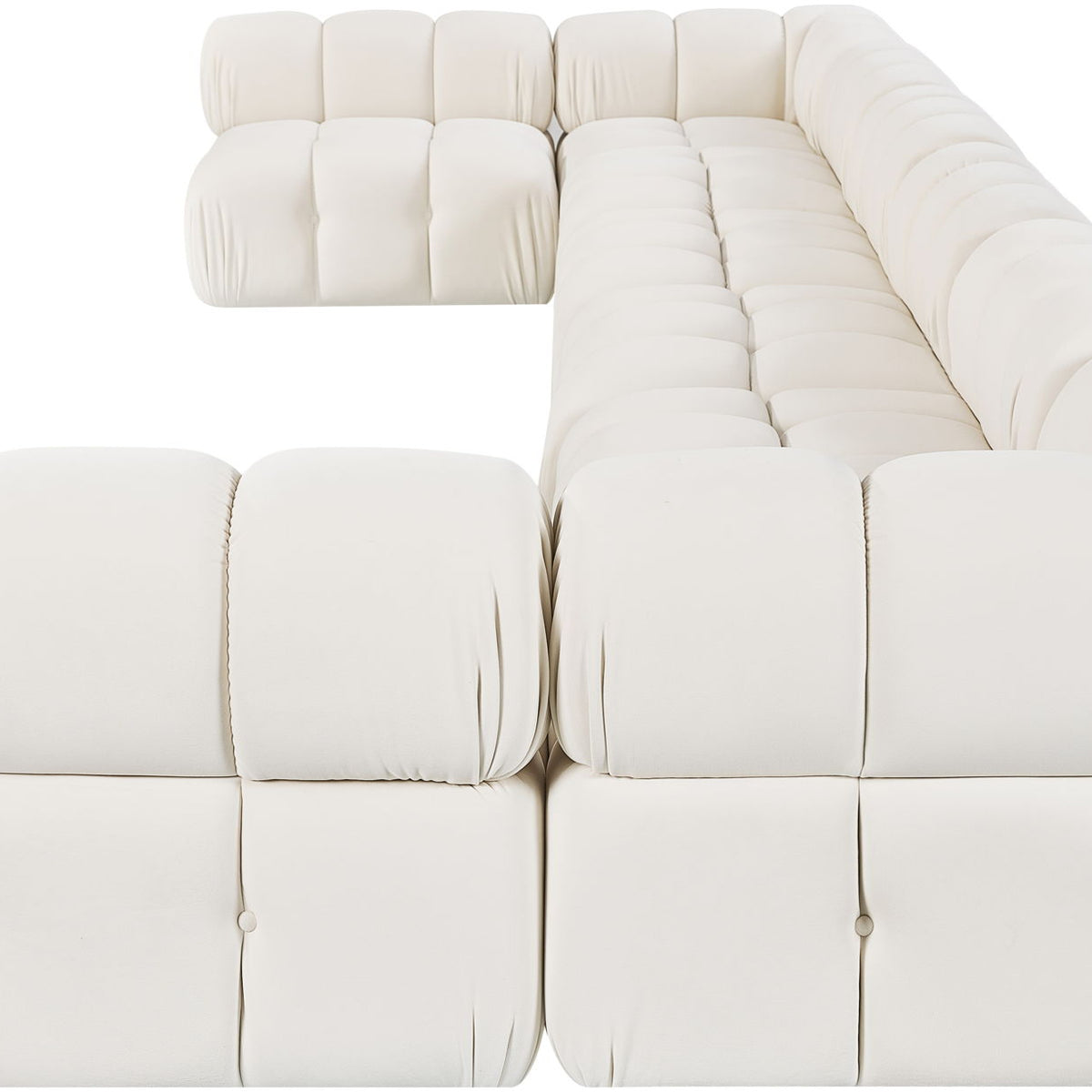 Light beige modular sectional sofa with plush padded seat and back cushions