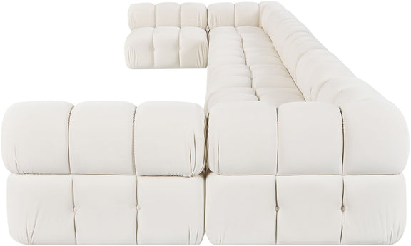 Light beige modular sectional sofa with plush padded seat and back cushions