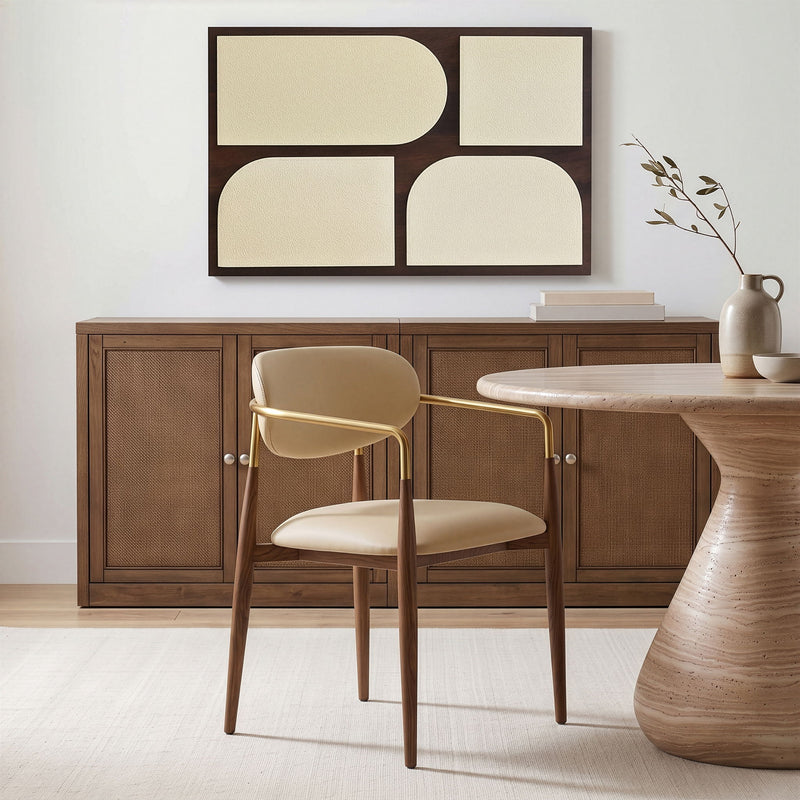 Beige upholstered dining arm chair with gold arm frame and wooden legs