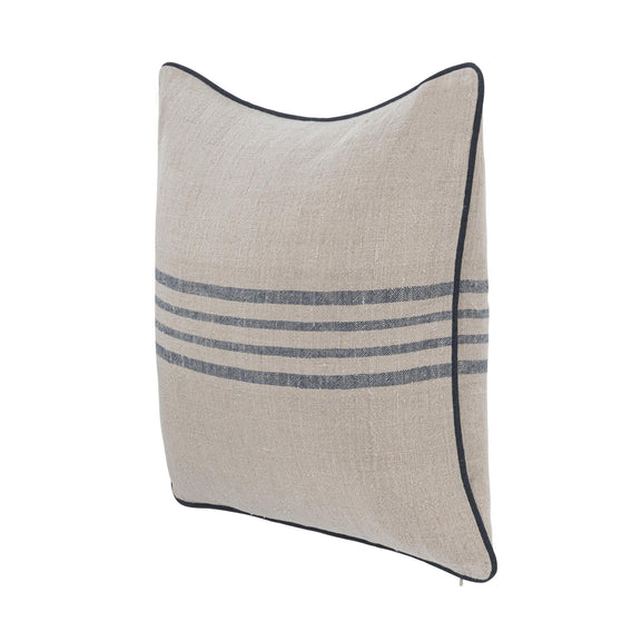 Natural linen pillow with blue stripe band and dark piped edge, angled side view.