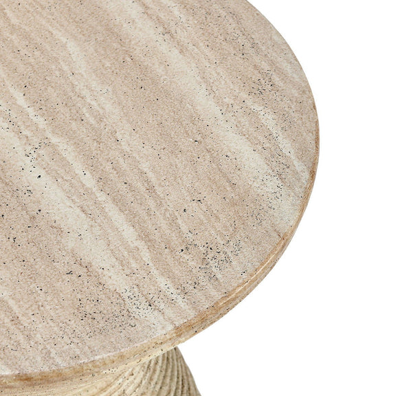 Beige round tabletop surface with speckled stone finish, angled close-up