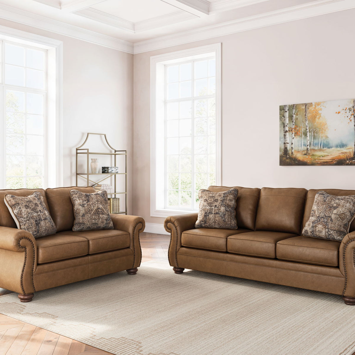 Living room set in dark brown with loveseat and sofa, patterned accent pillows on cushions