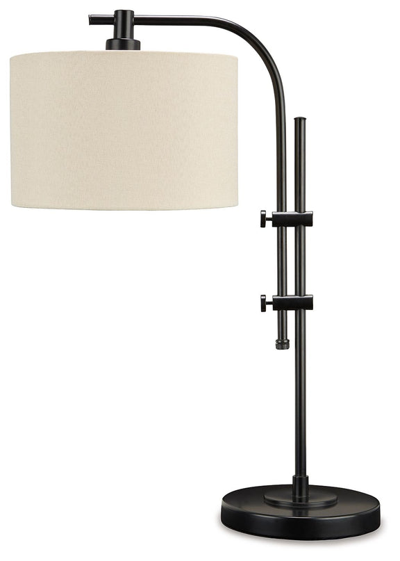 Black metal floor lamp with curved top support, cream drum shade, and round base.