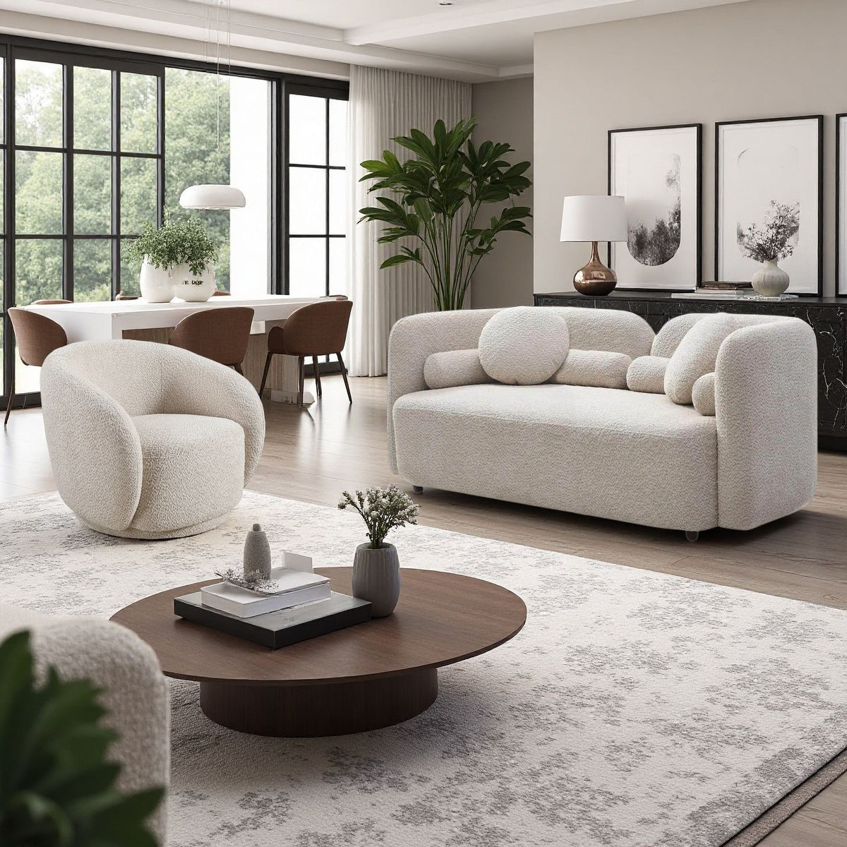 Beige upholstered sofa with rounded arms and two matching accent chairs