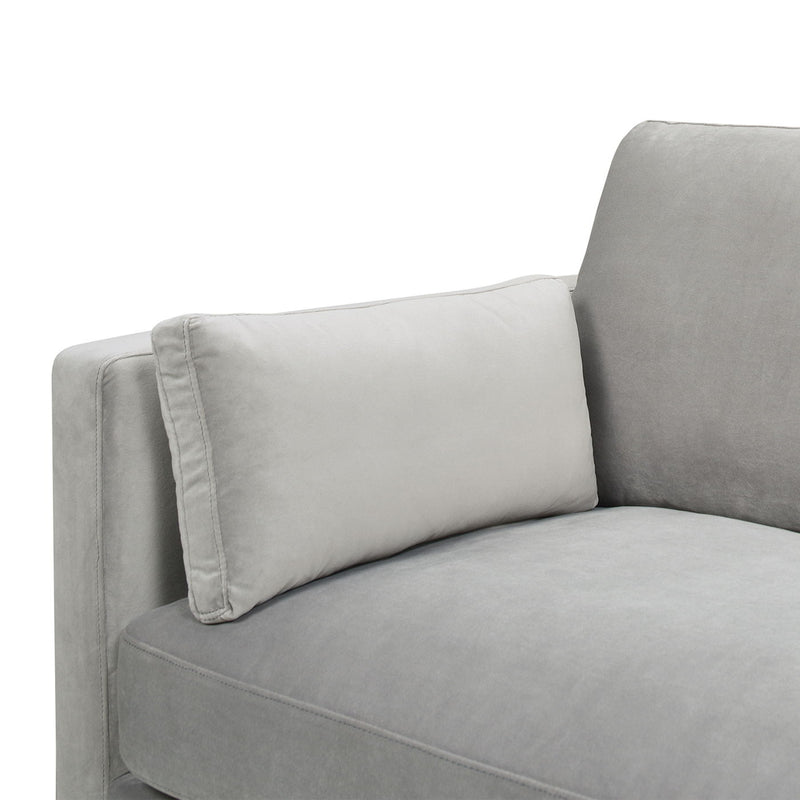 Light gray sofa arm and back cushion with soft, boxy padding.