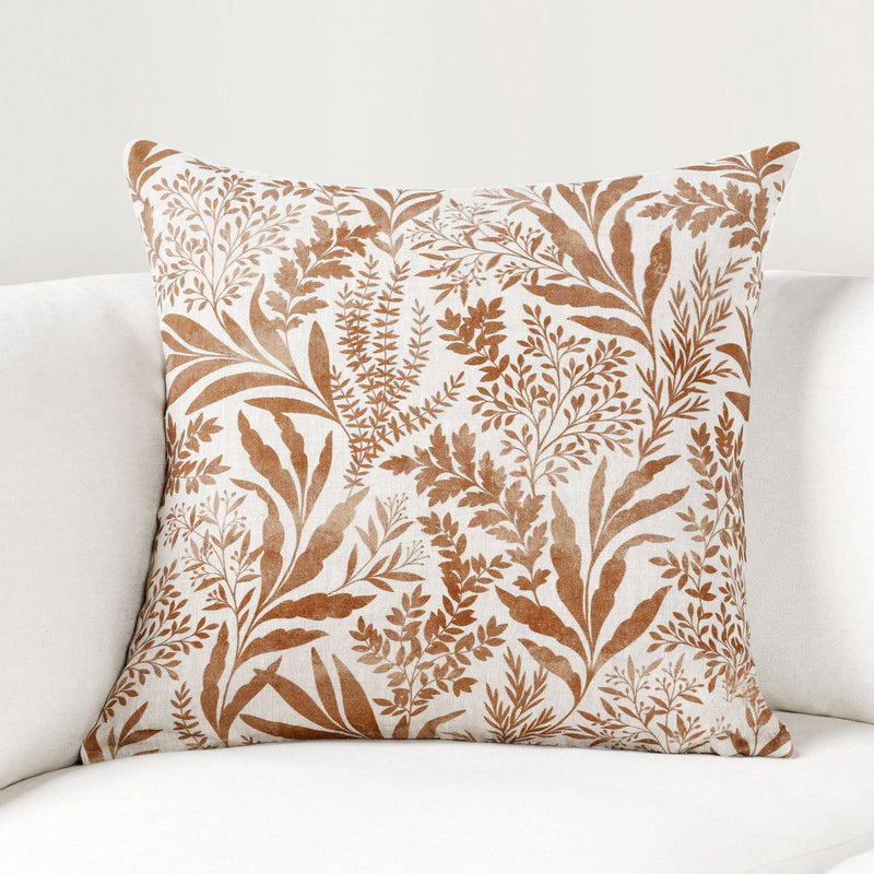 Rectangular pillow with tan and chestnut botanical leaf and branch print