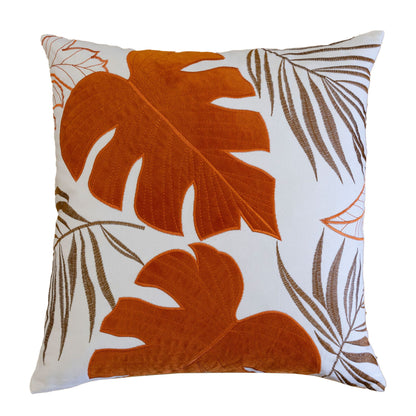 Leaf accent throw pillow with orange tropical leaves and botanical linework.