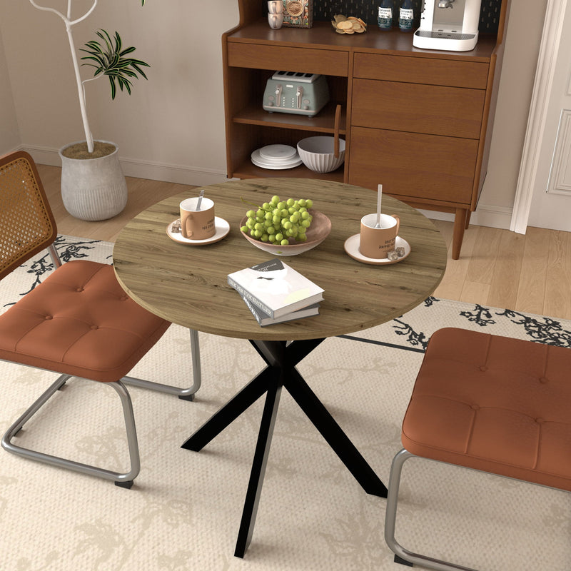 Compact round table with rustic wood surface and black X base in a dining setup