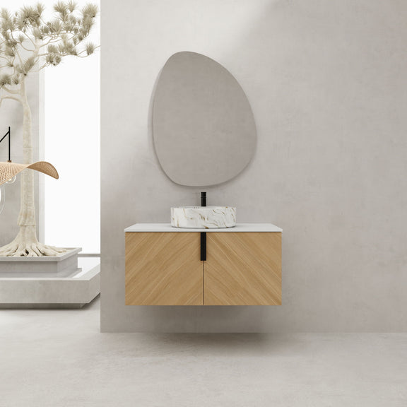 Wall-mounted bathroom vanity with light wood doors, white countertop, and white vessel sink