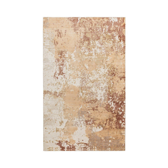 Distressed rectangular area rug with warm beige base and rust-brown textured pattern
