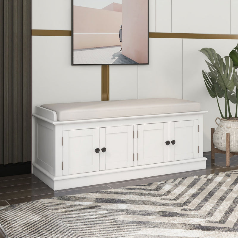 White shoe bench with a light cushion and four storage doors