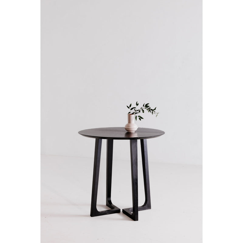 Round black ash counter table with dark pedestal base and smooth circular top