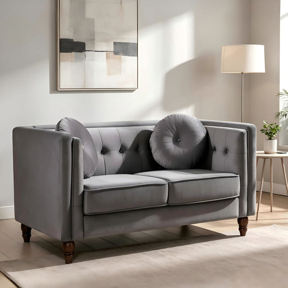 Gray 2-seater velvet loveseat with tufted back and round accent pillows