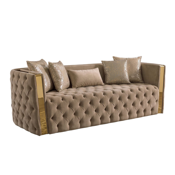 Taupe button-tufted sofa with gold-tone arms and 4 decorative pillows, side view