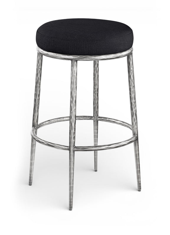 Black upholstered round backless bar stool with antique silver metal legs and footrest