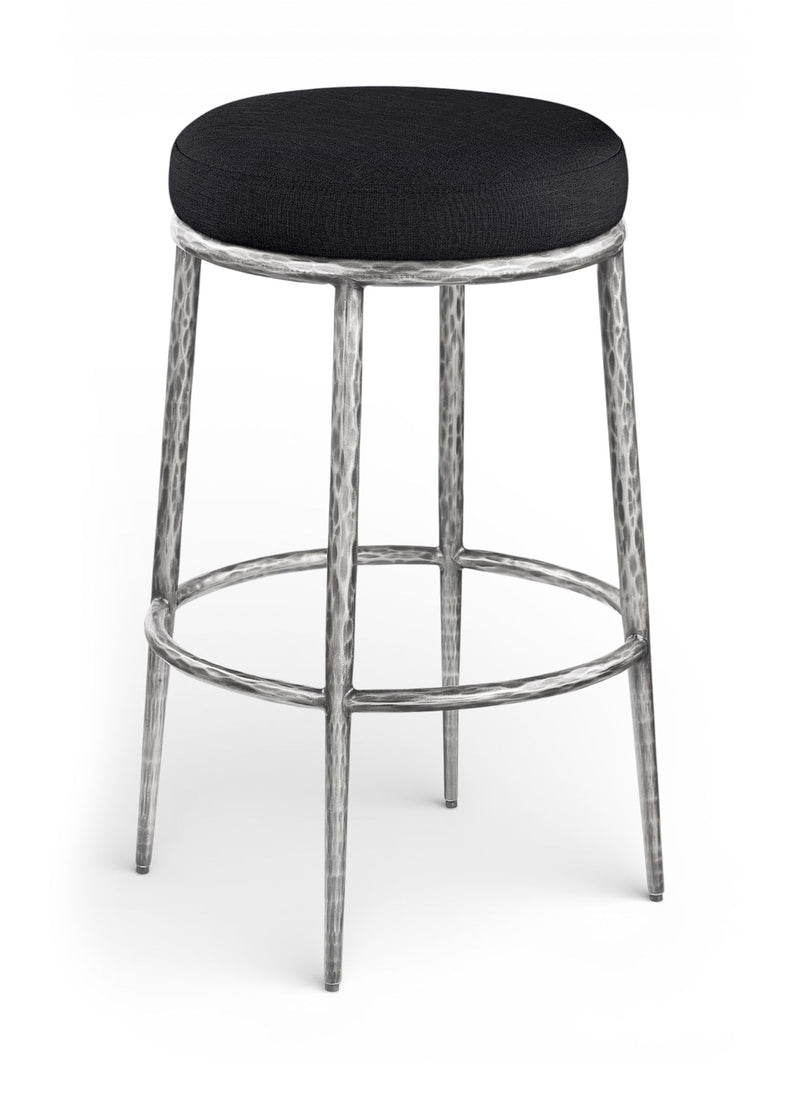 Black upholstered round backless bar stool with antique silver metal legs and footrest