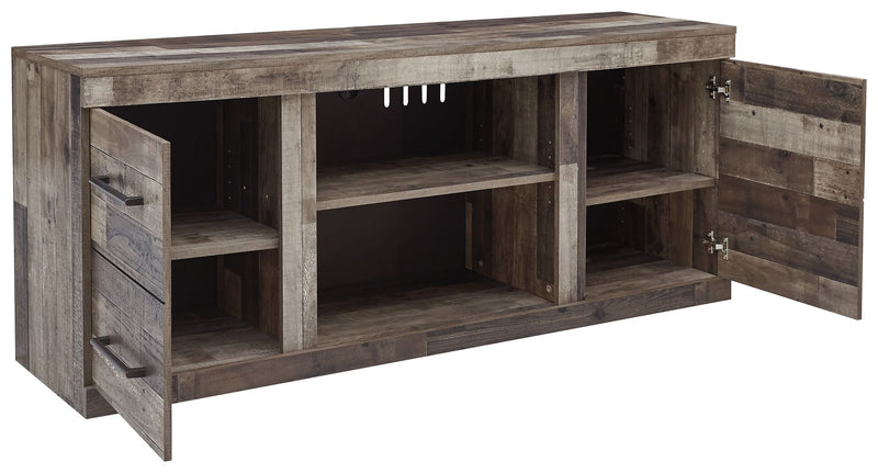 Gray TV stand with open shelves and side drawers, angled view of cabinet