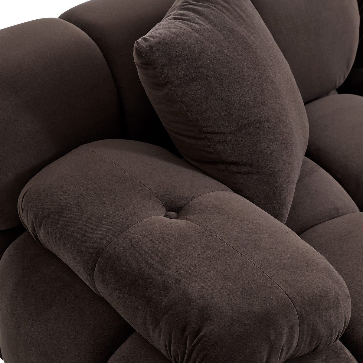 Brown loveseat seat cushion with visible seam and soft fabric texture, plus matching throw pillow