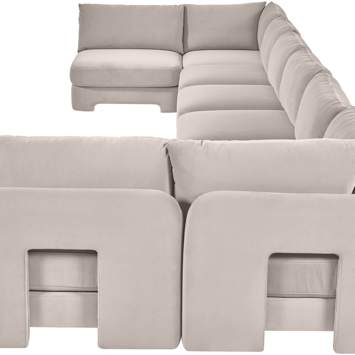 Light gray velvet U-shaped armless sectional sofa with padded cushions and chaise backrests