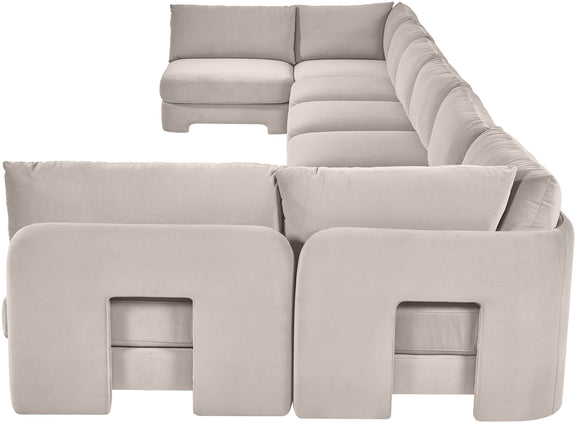 Light gray velvet U-shaped armless sectional sofa with padded cushions and chaise backrests