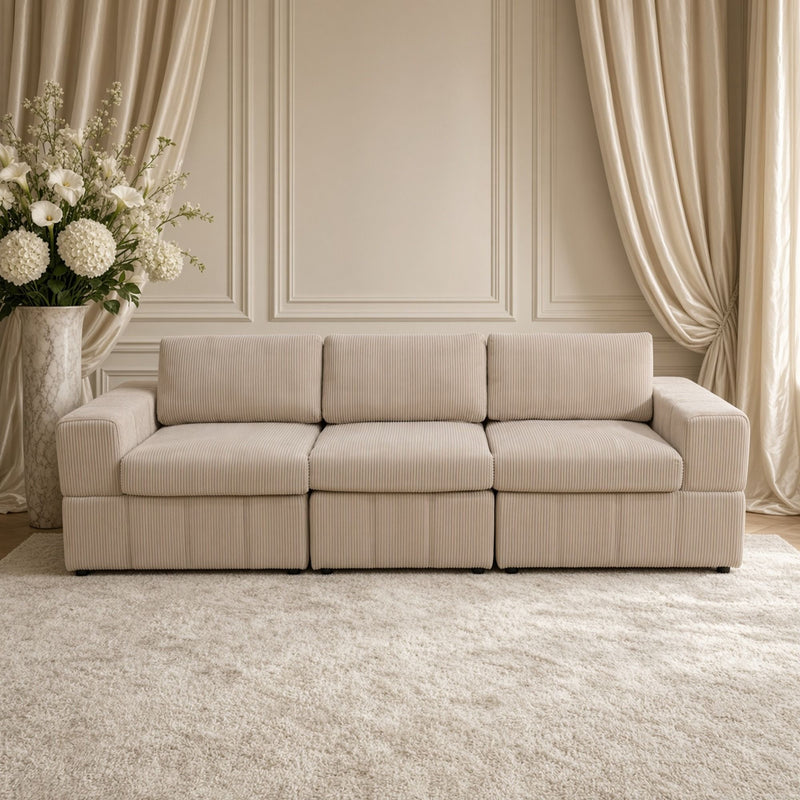 Beige three-seat sectional sofa with ribbed upholstery and matching modular bases