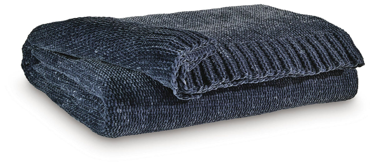 Anawood throw, dark blue woven fabric with folded drape and ribbed edge