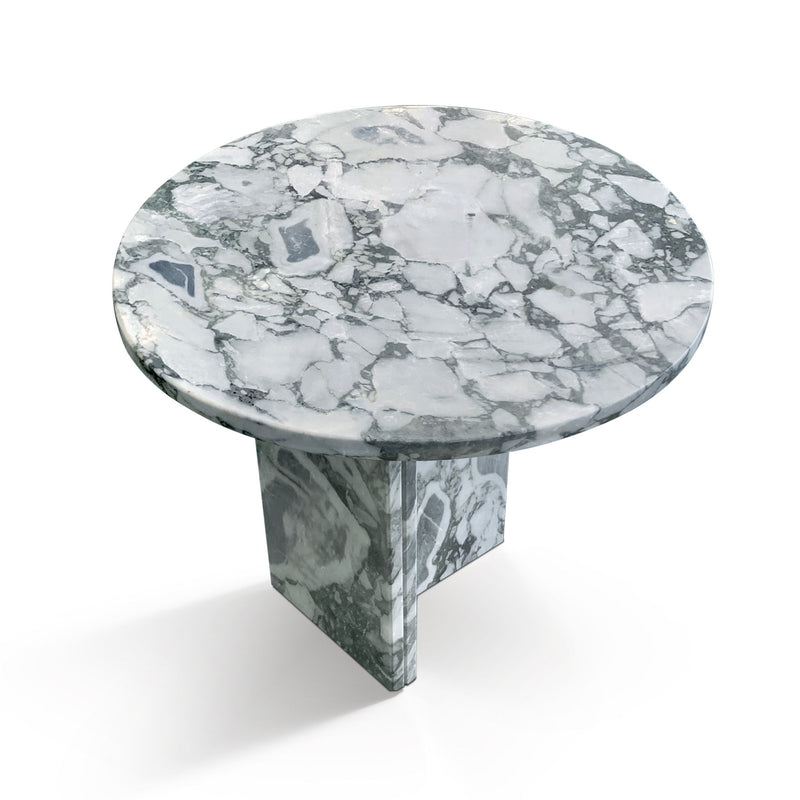 White and gray veined round stone coffee table with dark greenish base supports