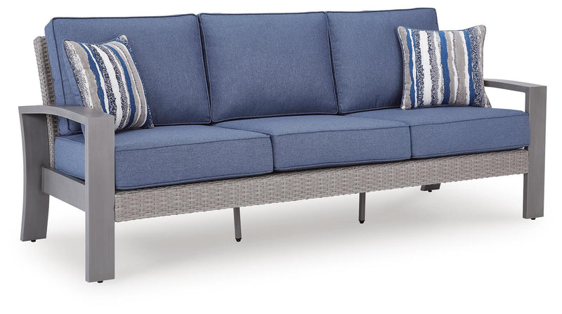 Blue-gray sofa with cushions and two striped pillows, armrests visible