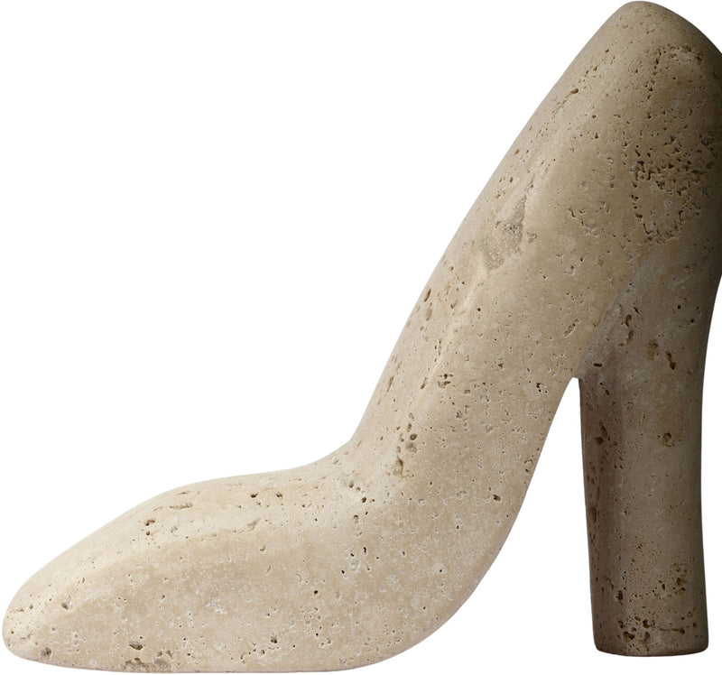 Beige travertine-style high-heel shoe sculpture, side view with speckled finish
