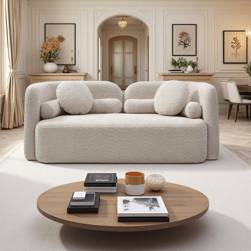 Light beige 2-seat upholstered sofa with tufted back cushions and rounded armrests