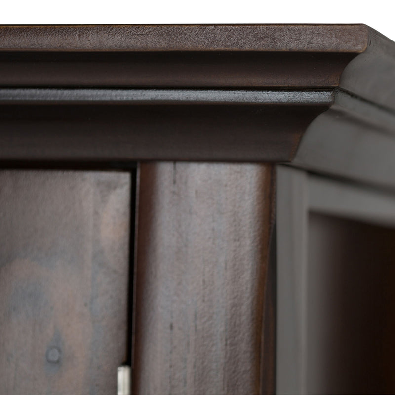 Brunette brown cabinet corner and top trim with visible wood paneling