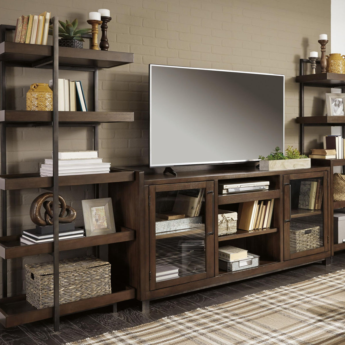 Dark brown TV stand with faux fireplace insert and side open shelving units