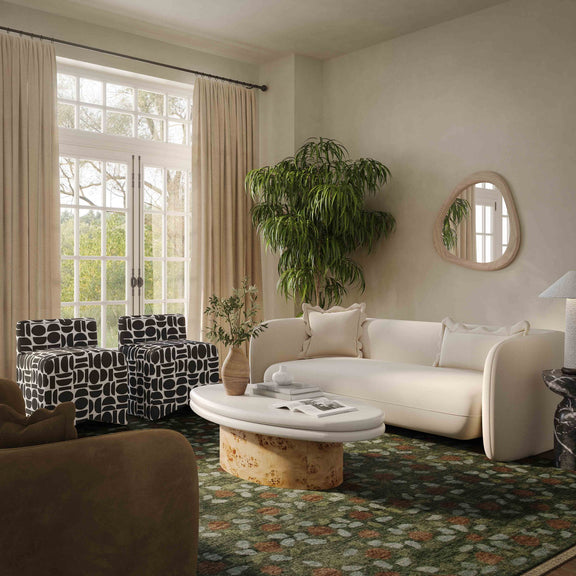 Cream fabric loveseat with two back pillows and rounded arms