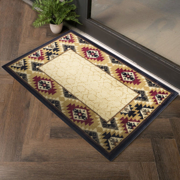 Beige southwest area rug with geometric border in black, maroon, and tan