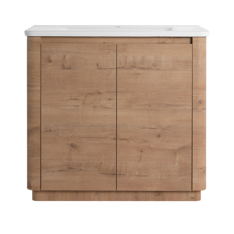 Freestanding bathroom vanity with white sink top and dark brown two-door cabinet
